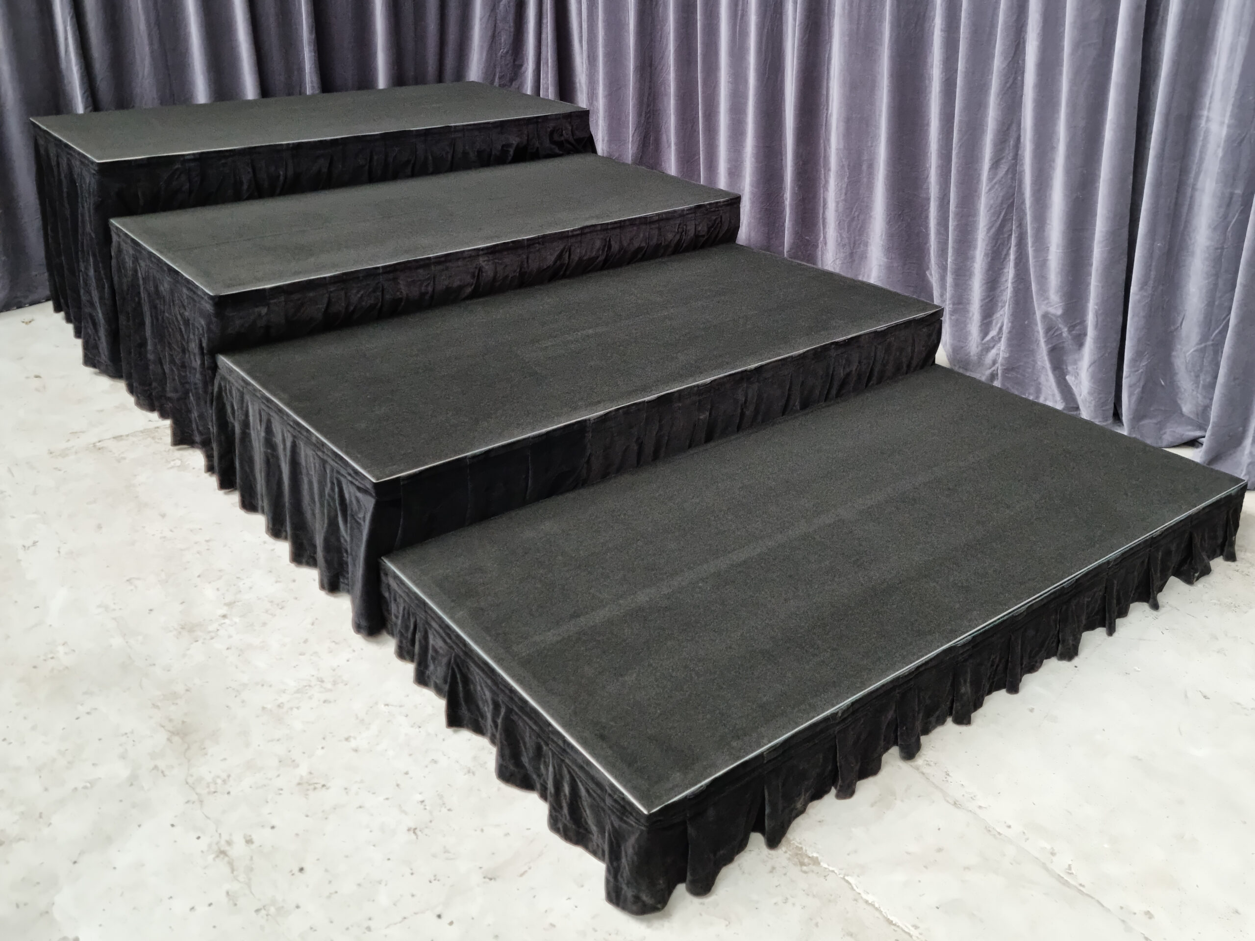 Tiered aluminium stage with skirting